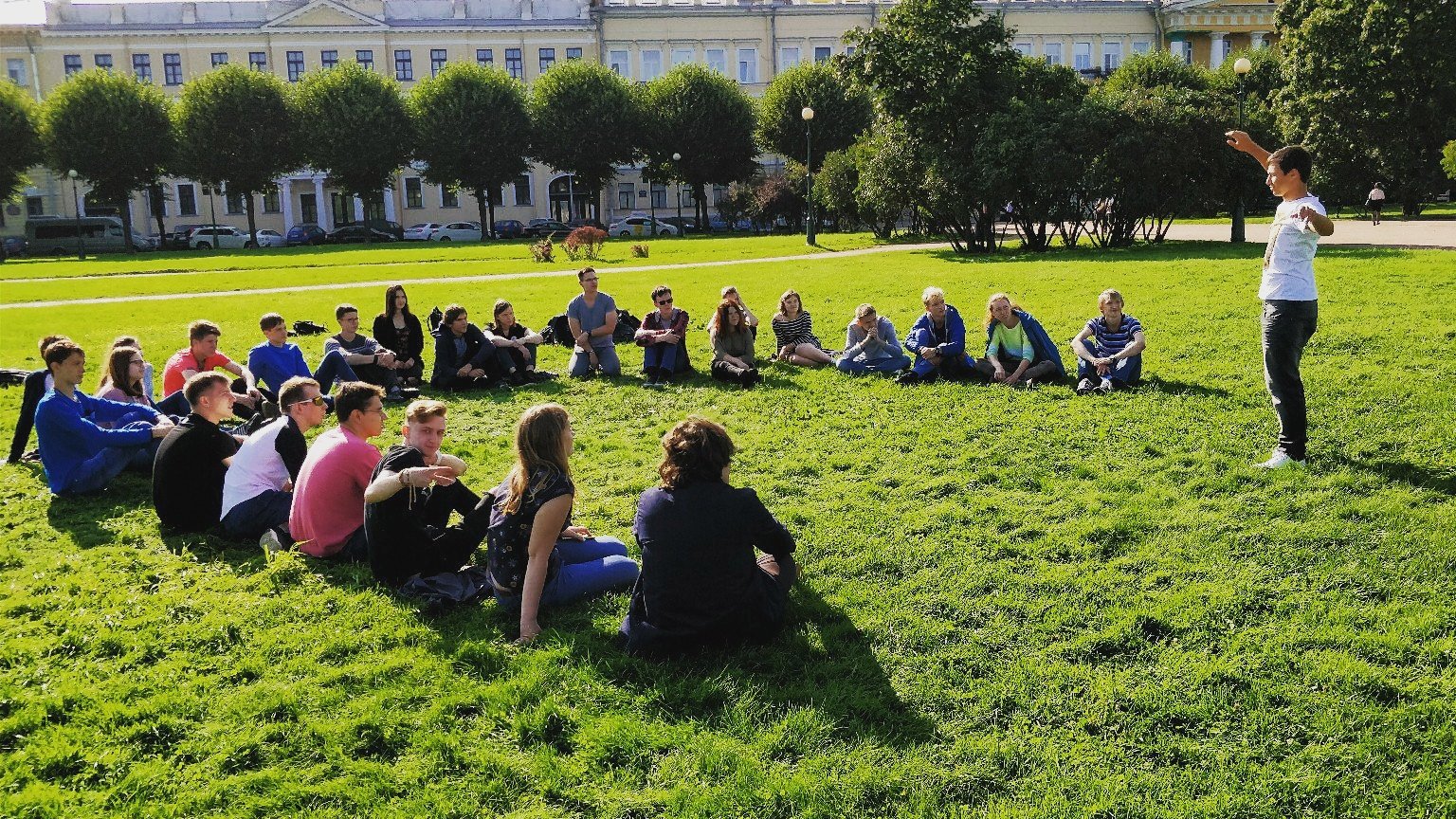 New ITMO University students gathered on a lawn