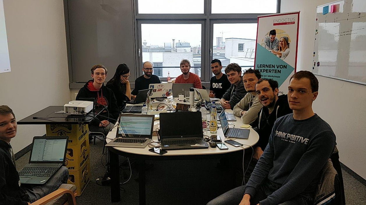 Plasma Mobile developers gathered around a table at the Berlin sprint