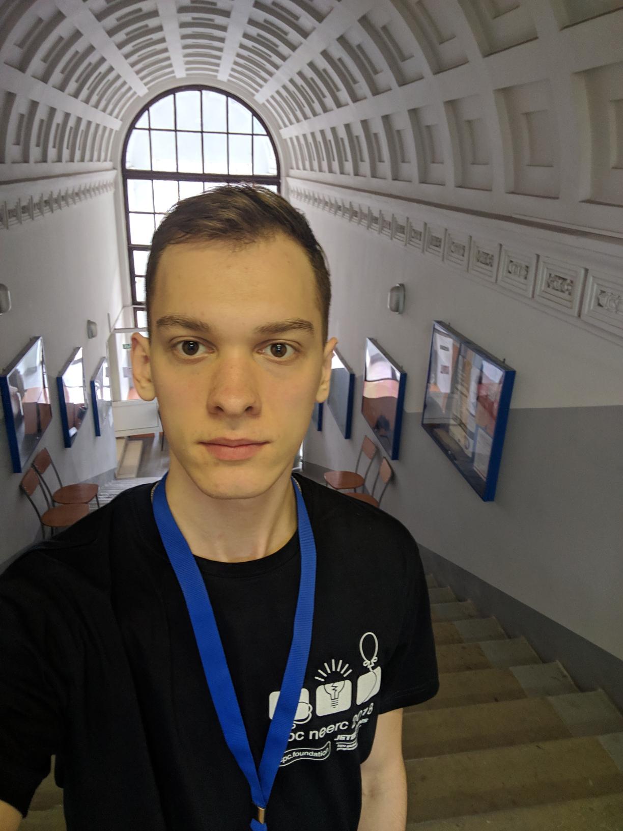 Ilya Bizyaev wearing an ICPC NEERC volunteer shirt